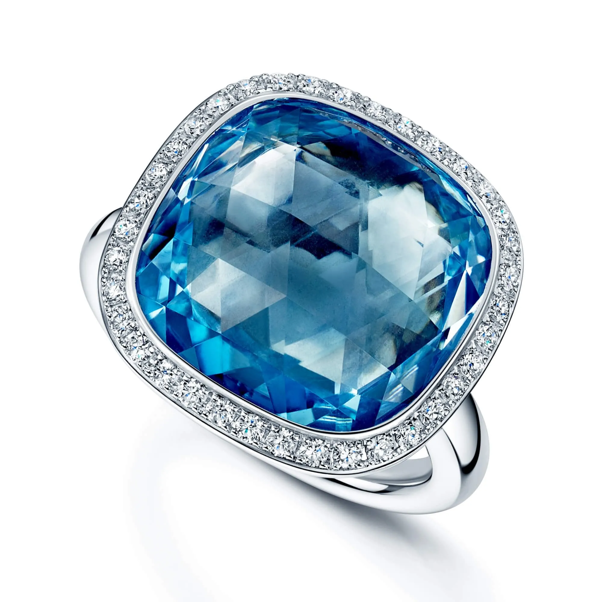 18ct White Gold Cushion Cut Sky Blue Topaz And Round Brilliant Cut Diamond Halo Ring