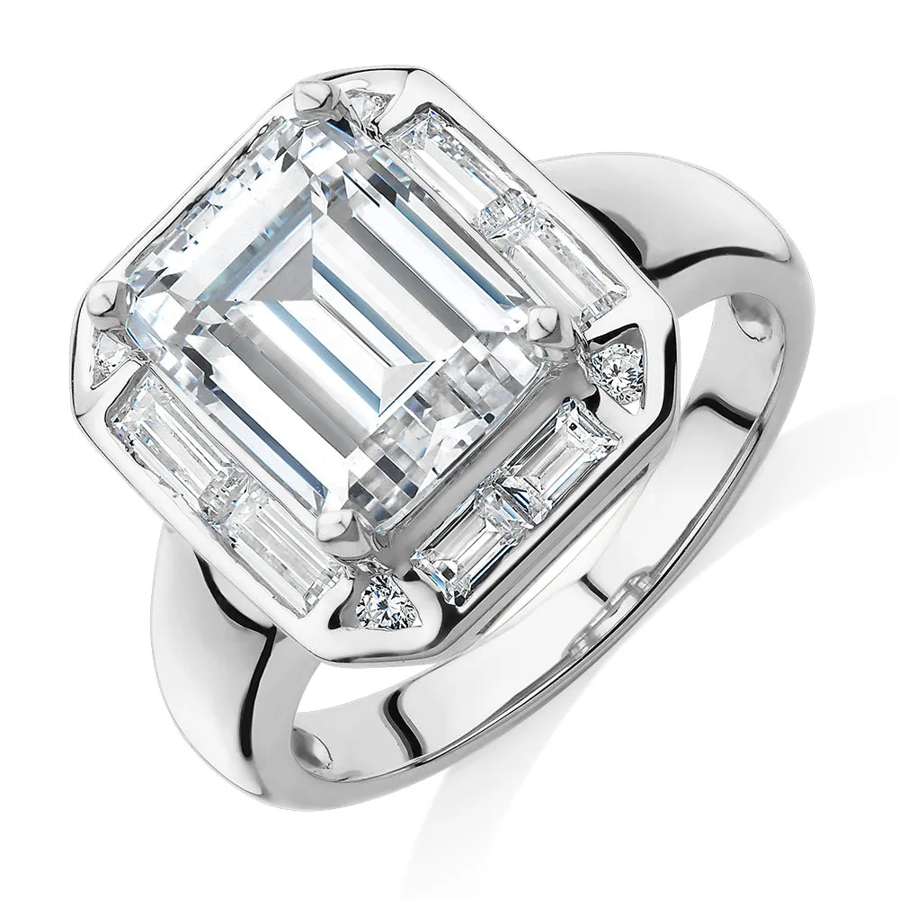 Emerald Cut, Baguette and Round Brilliant halo engagement ring with 4.53 carats* of diamond simulants in 10 carat white gold