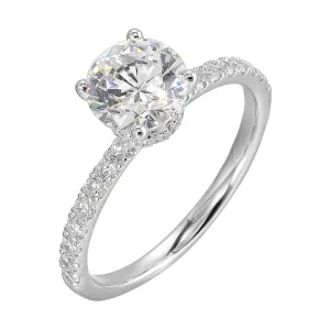 Shine from every angle with this gorgeous round solitaire hidden halo engagement ring. This timeless design offers elegance making it everlasting symbol of your love.